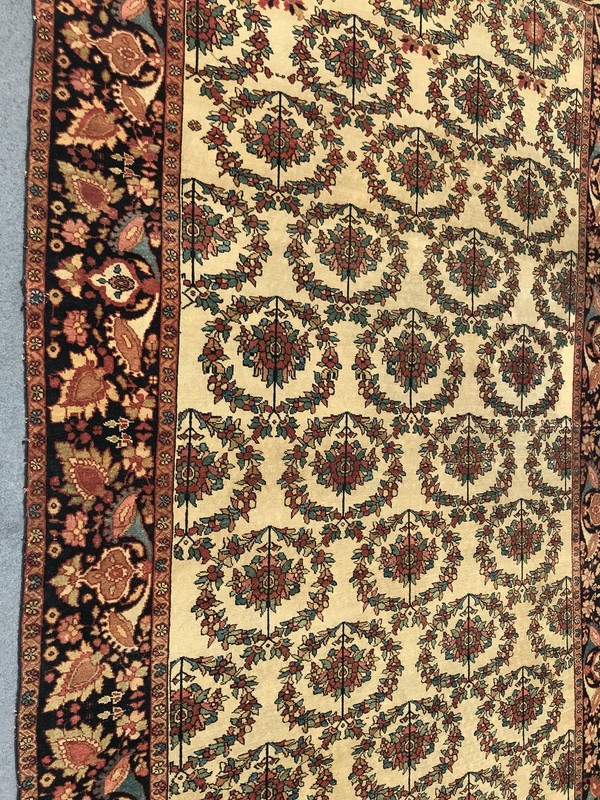 AN ANTIQUE FARAHAN SARROOK RUG gallery