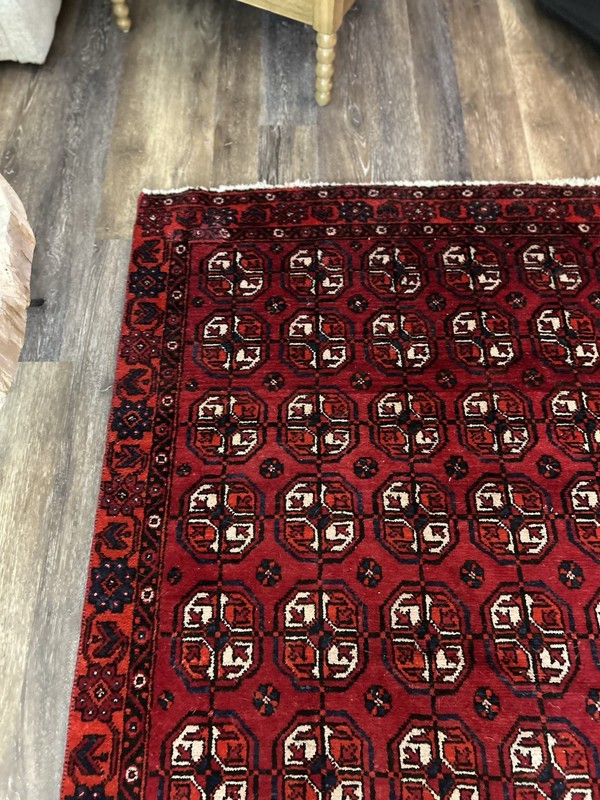 Wool hand-knotted Turkmen rug with geometric patterns in red (4' x 6') gallery
