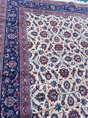 Used, 9′ X 11′ wool rug in good condition. Nice color and floral design