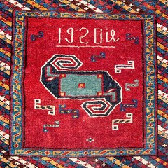 A FANTASTIC ANTIQUE ARMENIAN PINWHEEL KAZAK INSCRIBED DATED SADDLE BAG RUG