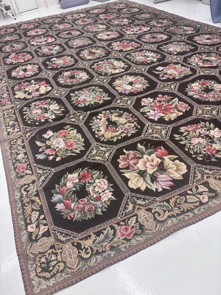 handwoven French Aubusson needlepoint wool rug with a floral medallion design.