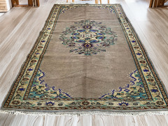 Vintage Turkish Rug | 5.4 x 8.7 ft Hand-Knotted Wool Faded Pastel Anatolian Rug