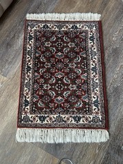 Hand-knotted wool Persian or Turkish small area rug w/traditional floral motifs