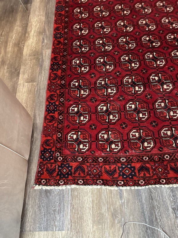 Wool hand-knotted Turkmen rug with geometric patterns in red (4' x 6') gallery