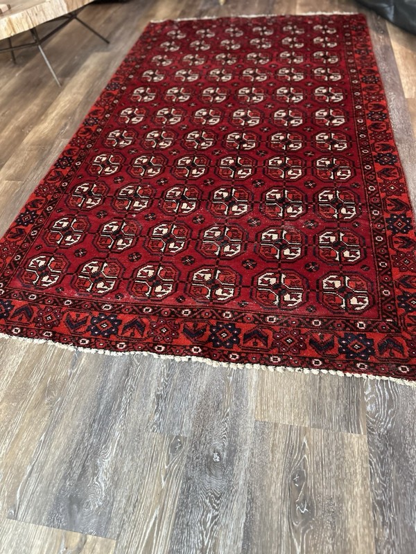 Wool hand-knotted Turkmen rug with geometric patterns in red (4' x 6') gallery