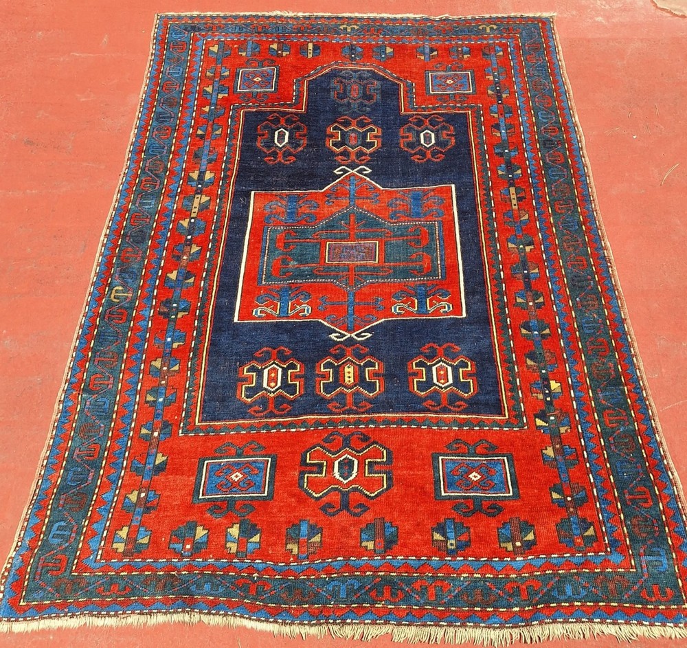 an antique Fachralo Kazak rug