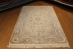 High Quality Handmade Rug made out of Natural wool and Silk Beige background