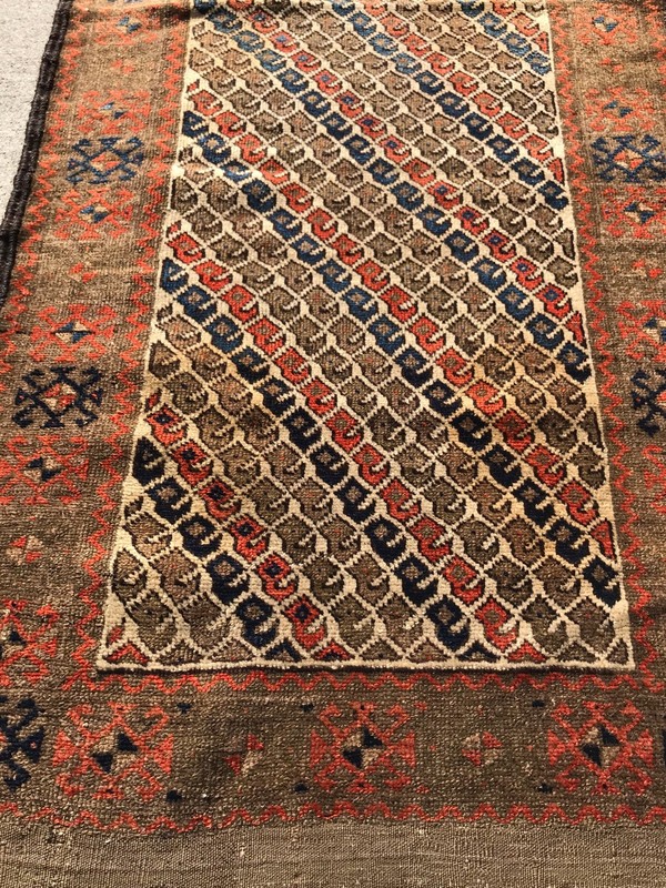 AN ATTRACTIVE IVORY BACKGROUND COLOR BALOOCH TRIBAL RUG gallery