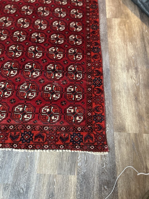 Wool hand-knotted Turkmen rug with geometric patterns in red (4' x 6') gallery