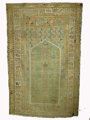 A 19th Century Prayer Rug with Muted Tones